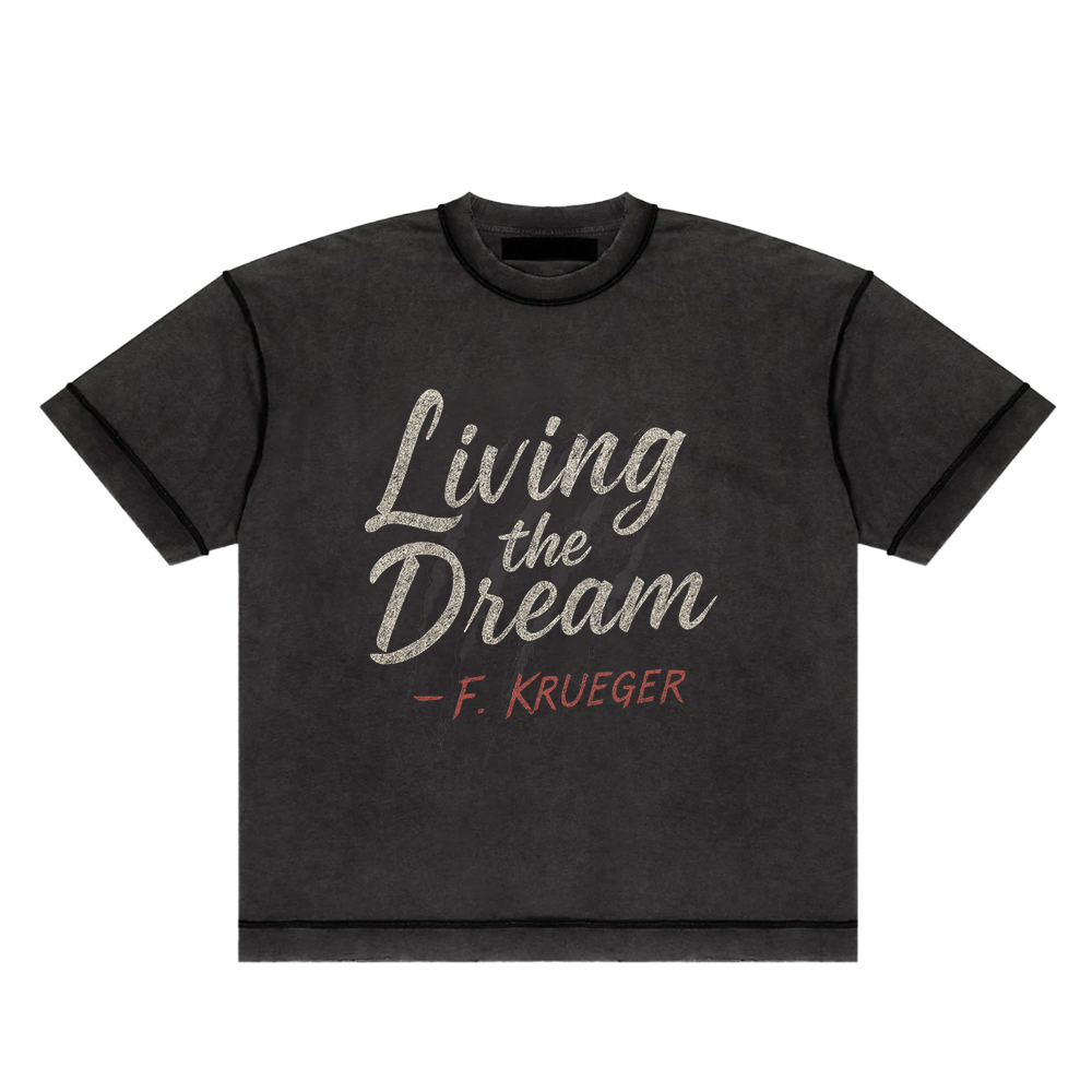 Screaming Saints black 'Living the Dream' unisex t-shirt with a vintage-style graphic and 'F. Krueger' text.