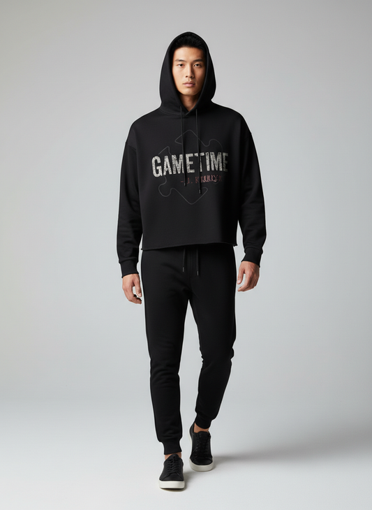 Screaming Saints J. Kramer Gametime cropped black horror streetwear hoodie featuring a distressed graphic on a male model.