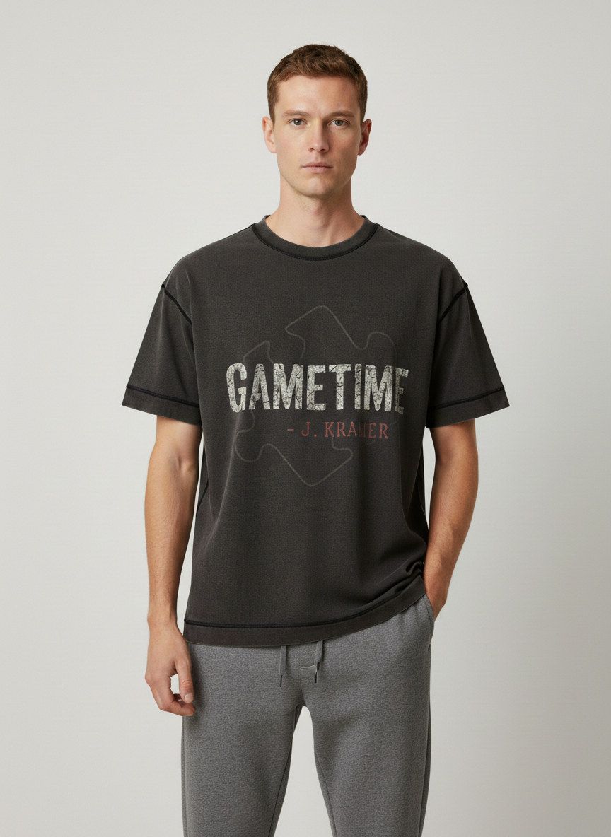 Screaming Saints Vintage Black Stitch Tee: Gametime J. Kramer horror shirt with a puzzle piece graphic and contrast stitching on a male model.