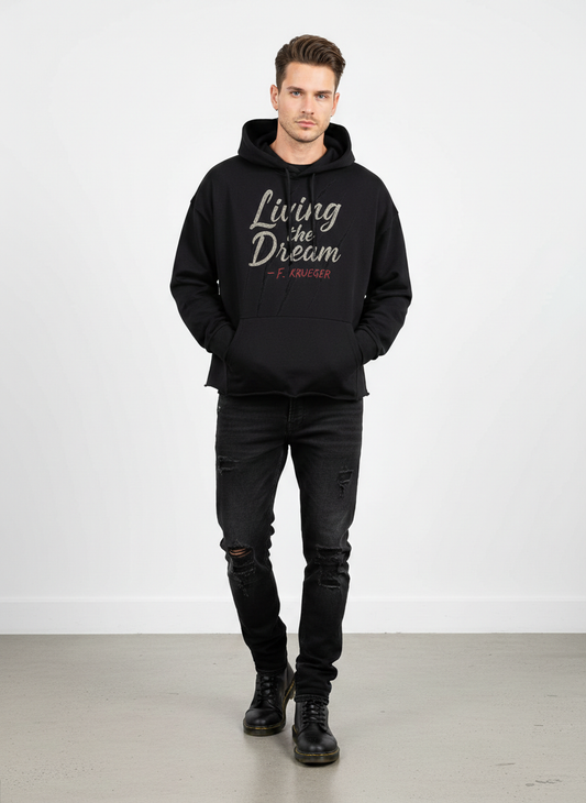 Screaming Saints Living the Dream F. Krueger cropped black horror hoodie with a vintage wash graphic on a male model.