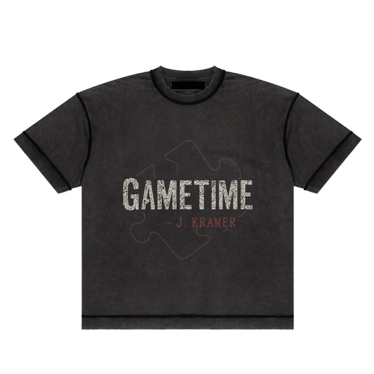 Screaming Saints black 'Gametime' unisex t-shirt with a vintage-style puzzle piece graphic and 'J. Kramer' text.